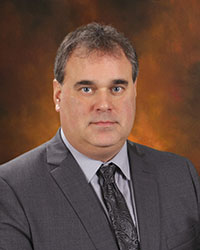 Headshot of BOE member T. Keenan