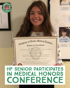 Photo shows one girl inside smiling while holding award