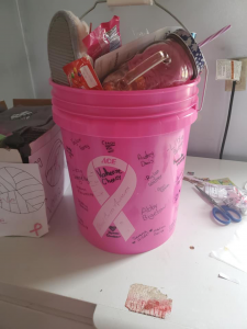 photo shows pink bucket filled with items