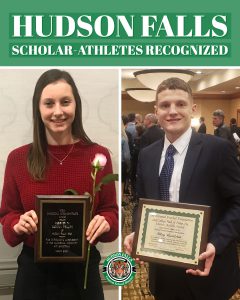 photo shows girl and boy holding plaques and smiling