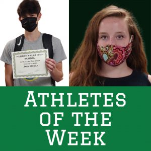 photo shows two students wearing masks and smiling