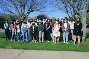 photo shows group of students smiling