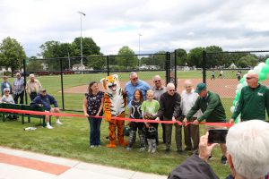 Tigers mascot and Village Mayor cutting the ribbon to open Moran-Derby park