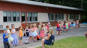 UPK Students performing songs and dance for their families