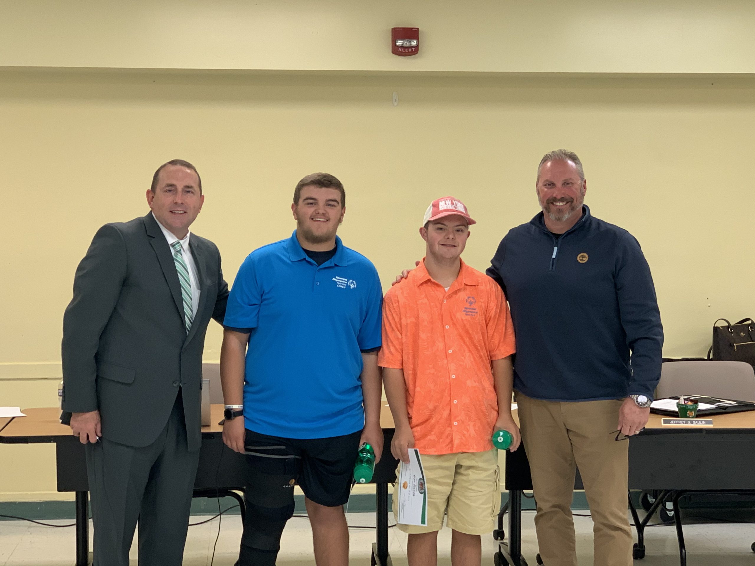 Group photo of Derek, Bryce with Superintendent Ward and BOE President Jeff Gaulin
