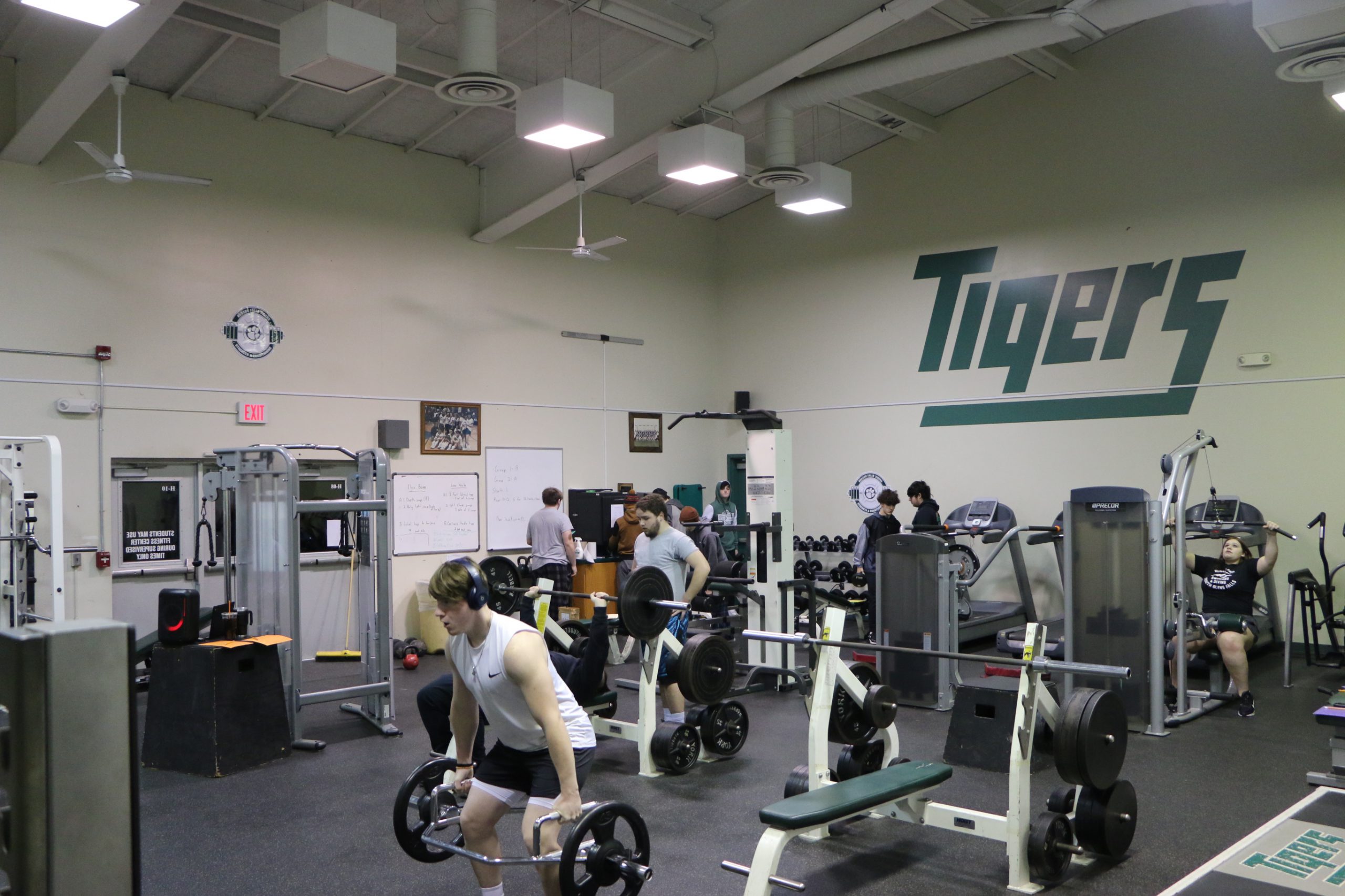 Students lifting weights in their zero block PE class