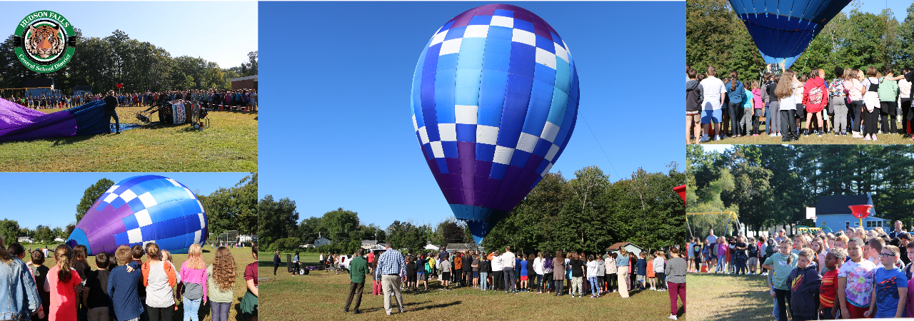 Picture of the Intermediate school looking at a Hot air balloon at an outdoor assembly