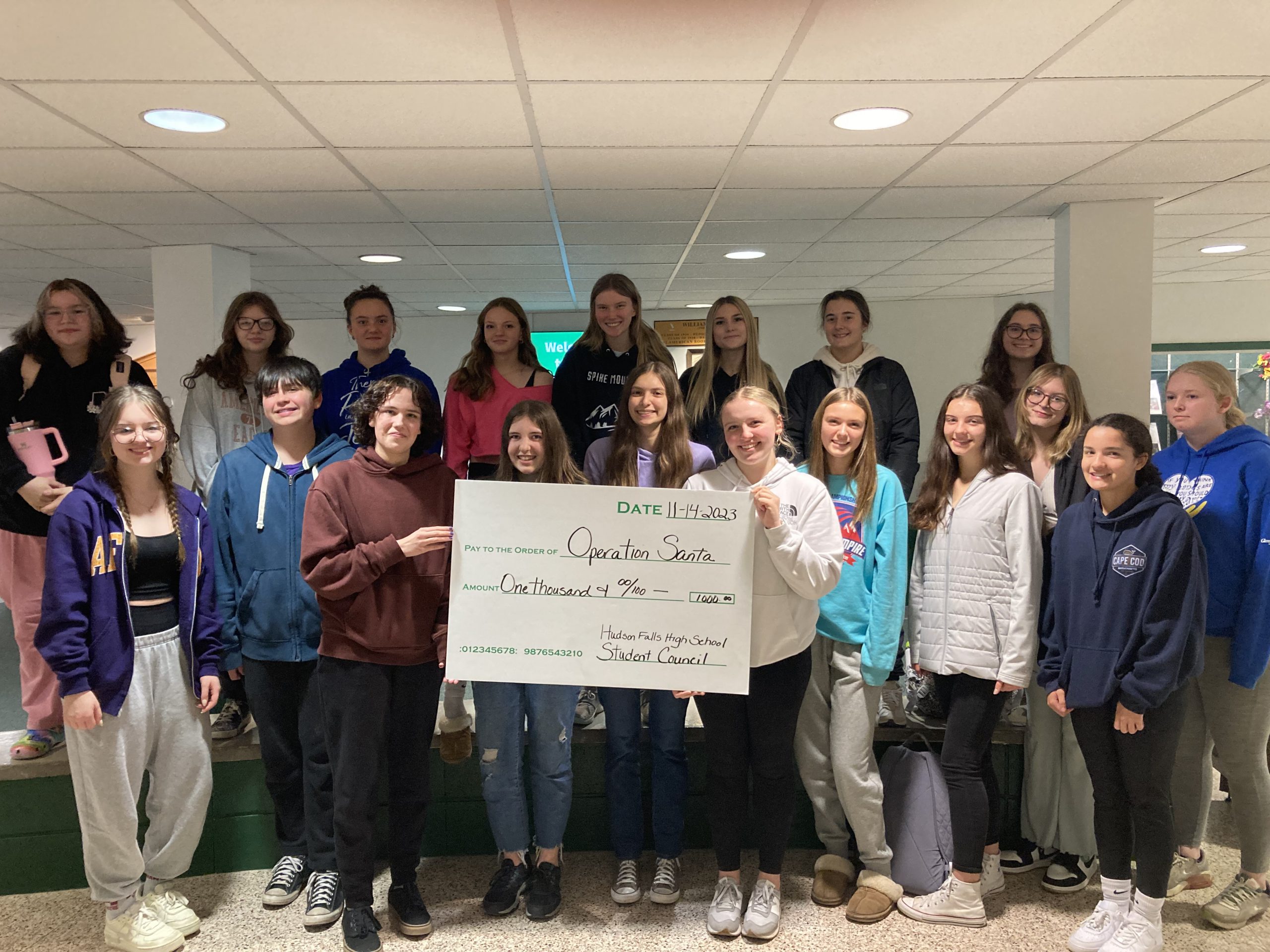 Photo of student council holding a giant check for a donation to Operation Santa