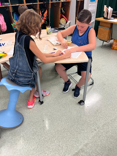 two students doing work together at a table in a newly renovated classroom at the Intermediate school