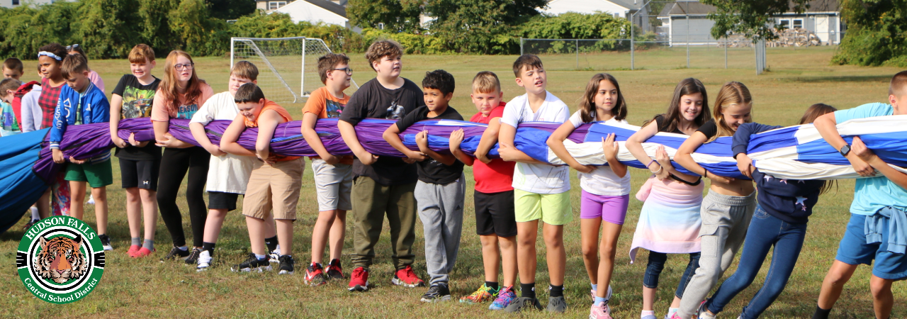 A photo of intermediate students helping hold a hot air balloon for pickup