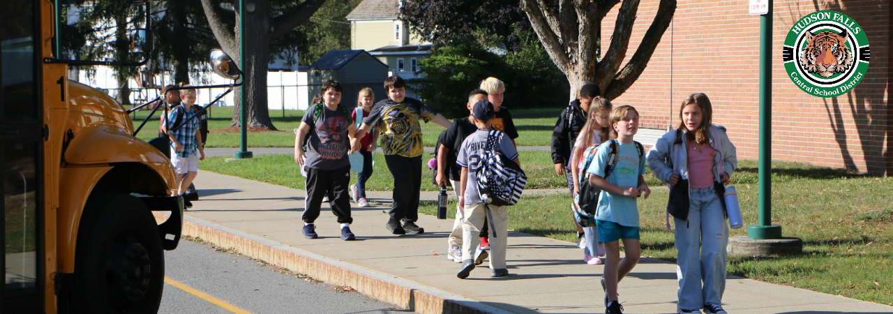 Students unloading the bus at the IS on the first day of school