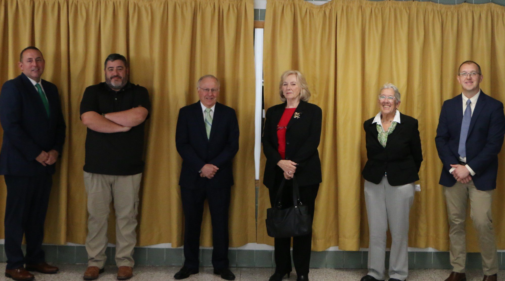 A photo of the the five Wall of Distinction Inductees in front of the wall prior to unveiling